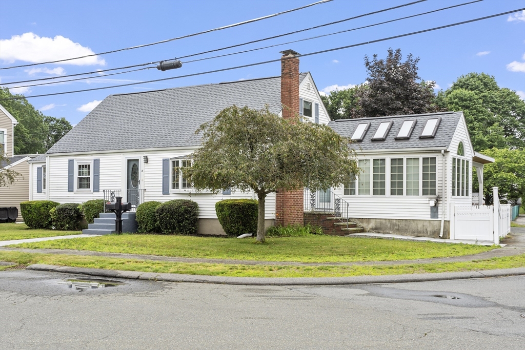 18 Rainbow Circle Peabody, MA 01960 - Photo 2 of 39 a front view of a house with a yard