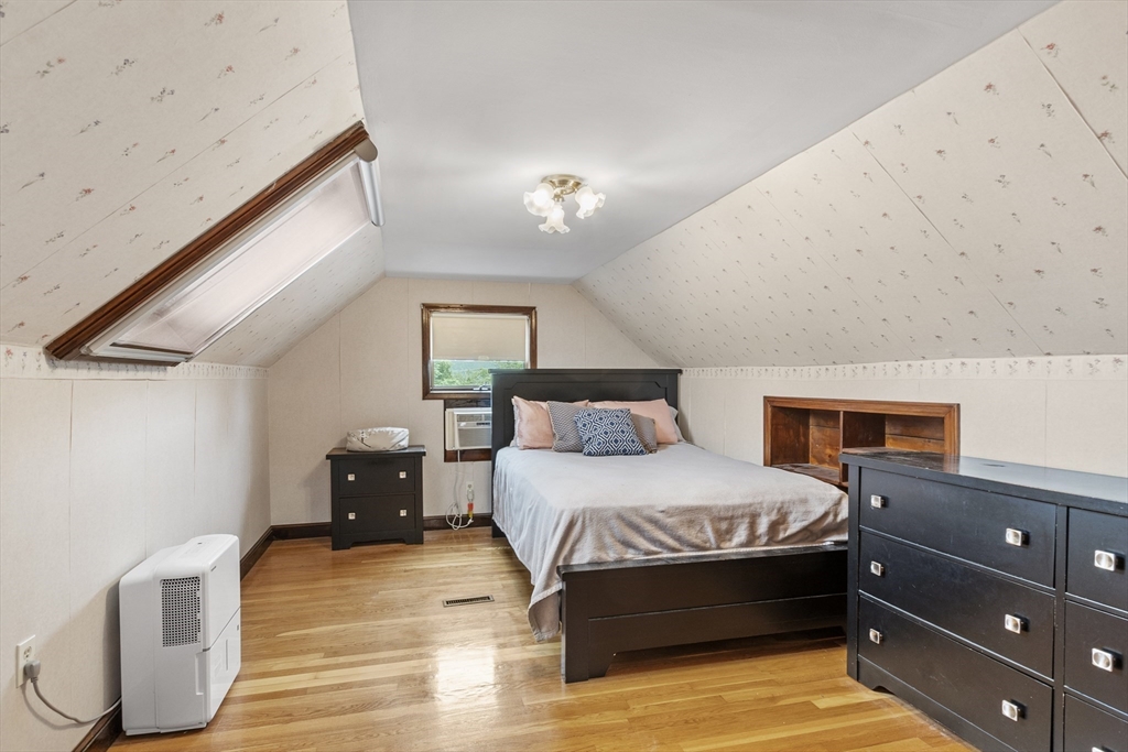18 Rainbow Circle Peabody, MA 01960 - Photo 21 of 39 a bedroom with a bed and a night stand