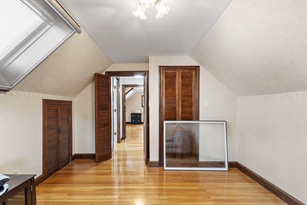 18 Rainbow Circle Peabody, MA 01960 - Photo 25 of 39 a view of a hallway with wooden floor and a bathroom
