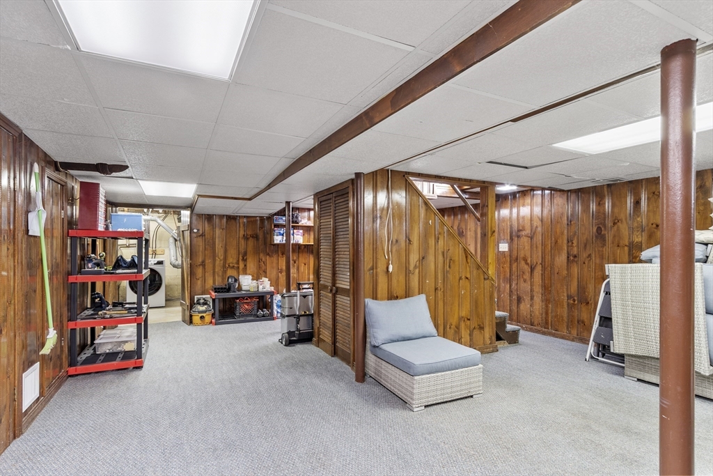 18 Rainbow Circle Peabody, MA 01960 - Photo 26 of 39 a living room with lots of furniture and gym equipment