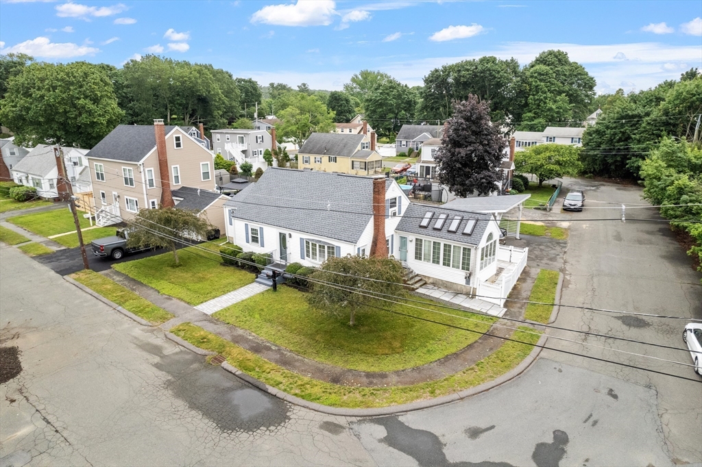 18 Rainbow Circle Peabody, MA 01960 - Photo 35 of 39 an aerial view of a house with swimming pool and trees