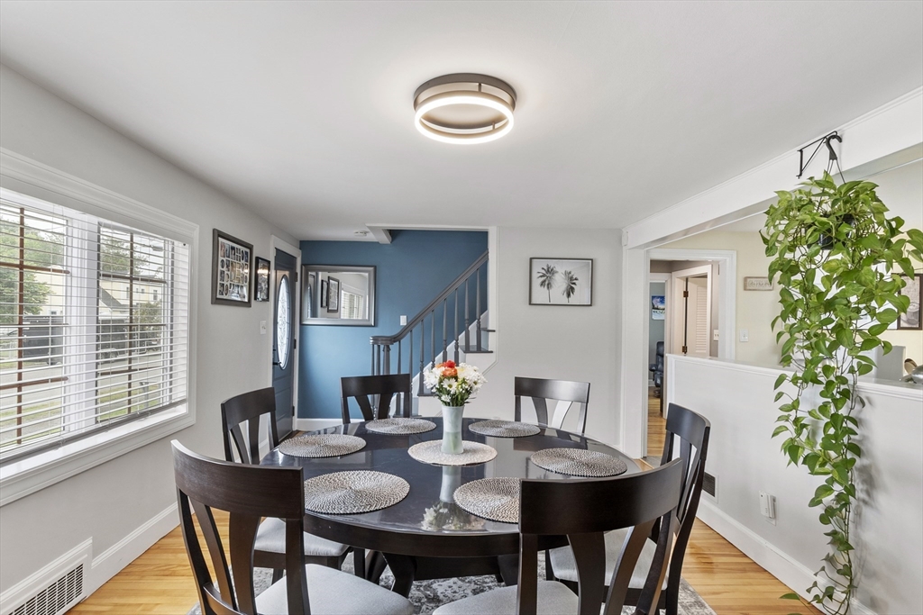 18 Rainbow Circle Peabody, MA 01960 - Photo 5 of 39 a view of a dining room with furniture window and wooden floor