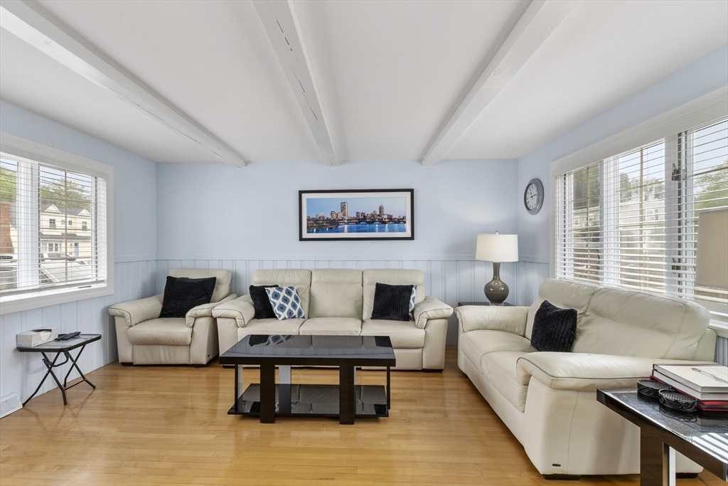 18 Rainbow Circle Peabody, MA 01960 - Photo 7 of 39 a living room with furniture and a large window