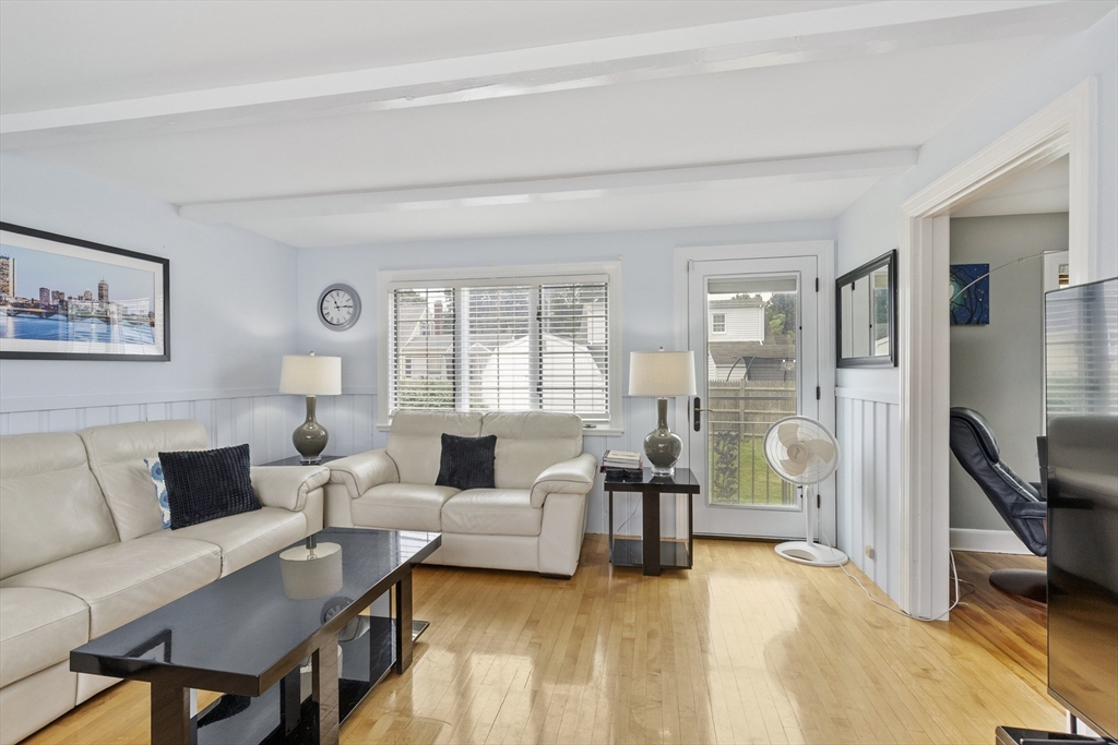 18 Rainbow Circle Peabody, MA 01960 - Photo 8 of 39 a living room with furniture and a large window