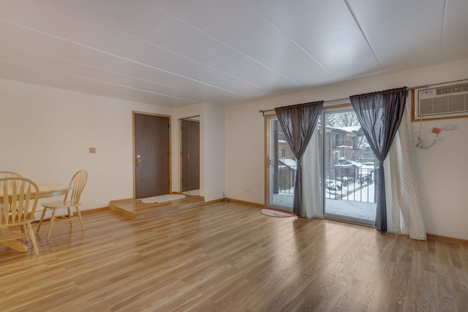 2505 Spring Street, Unit 3304 Woodridge, IL 60517 - Photo 5 of 17 a view of a livingroom with furniture and wooden floor