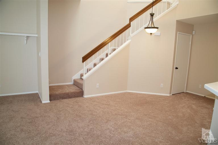 1736 Sinaloa Road, Unit 323 Simi Valley, CA 93065 - Photo 22 of 24 a view of an empty room with stairs