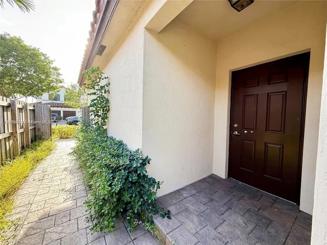 a view of a hallway with wooden shelves