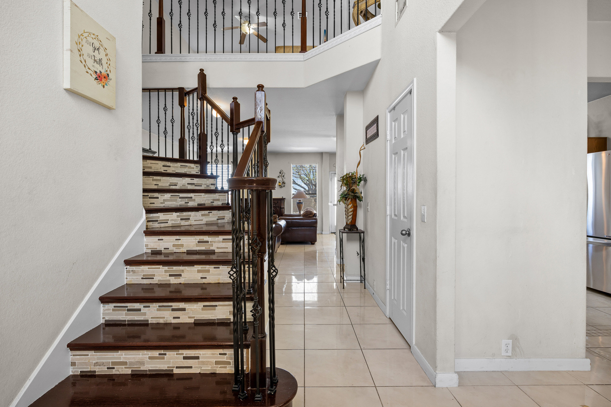 3502 Shiraz Loop Round Rock, TX 78665 - Photo 2 of 23 Stairs with a high ceiling and tile patterned flooring