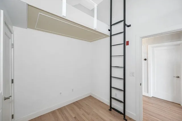 a view of front door with wooden floor