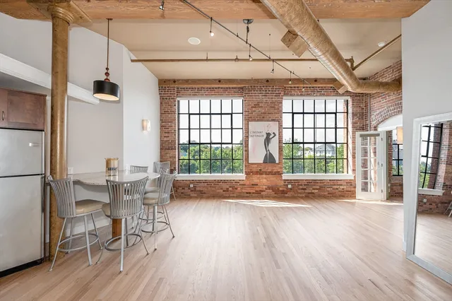 a view of a livingroom with furniture and wooden floor