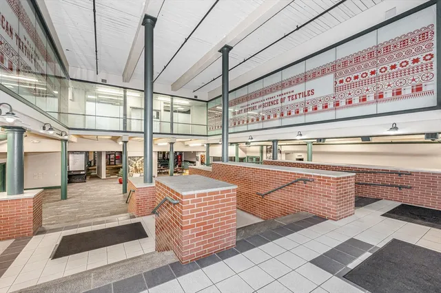 a room with lots of wooden furniture and lots of counter top space