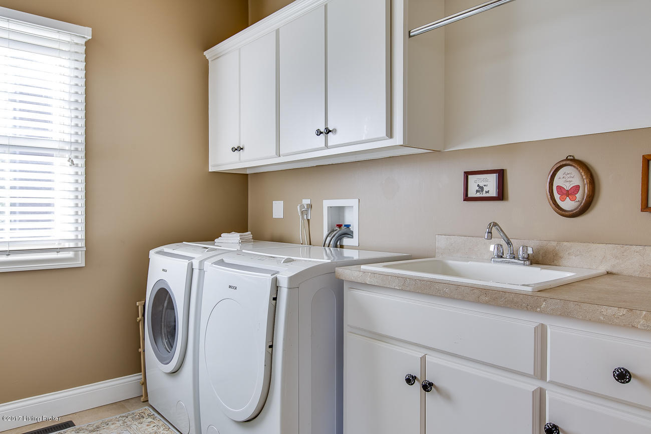 2901 Doe Ridge Court Prospect, KY 40059 - Photo 15 of 50 The laundry room features built-in storage wall with space for coats, boots and backpacks.