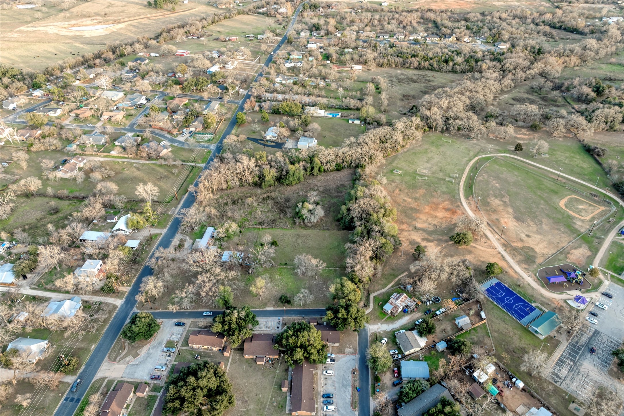 Lot 4 East Alamo Street Elgin, TX 78621 - Photo 12 of 14 an aerial view of multiple house