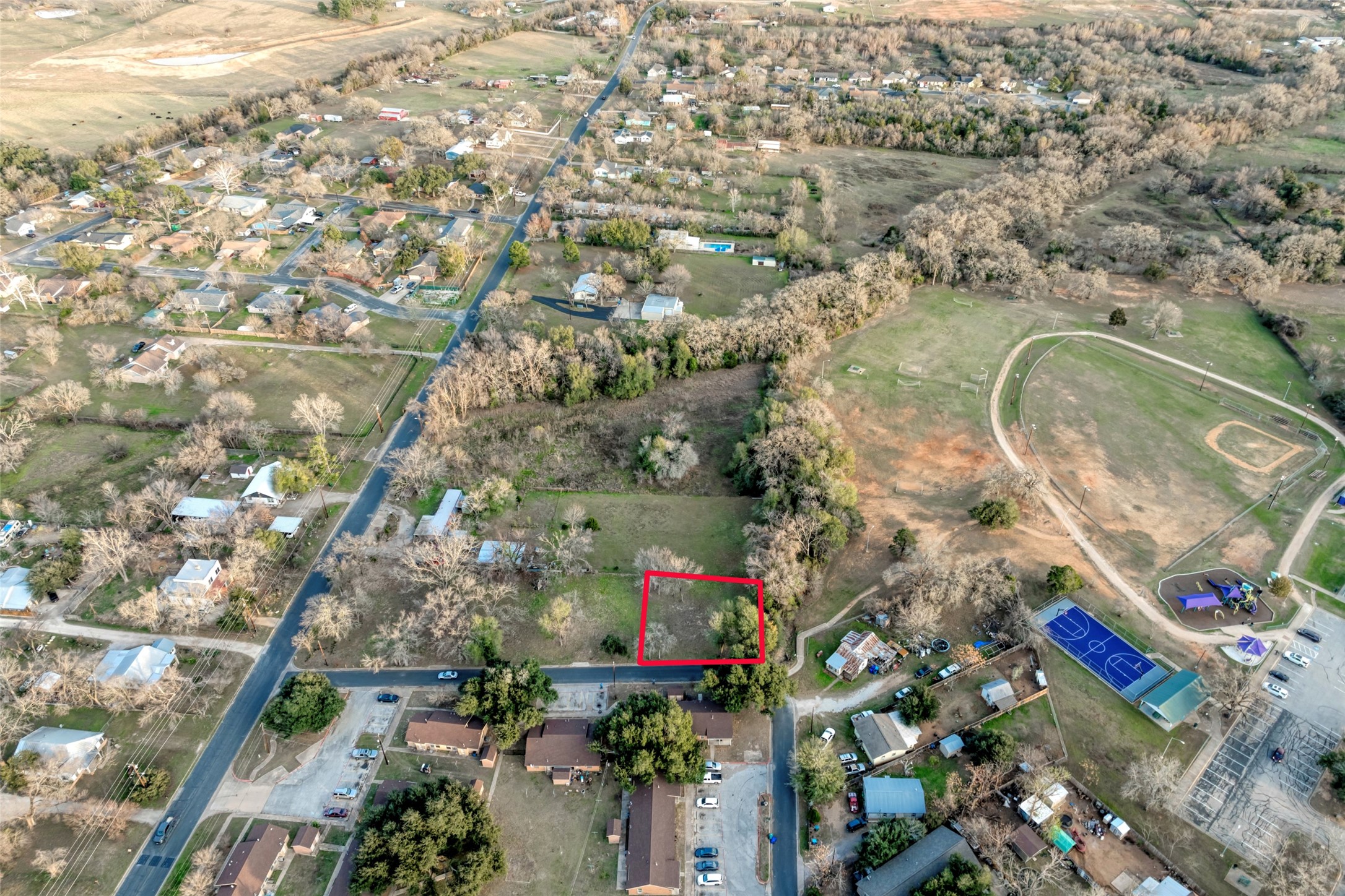 Lot 4 East Alamo Street Elgin, TX 78621 - Photo 3 of 14 an aerial view of multiple house