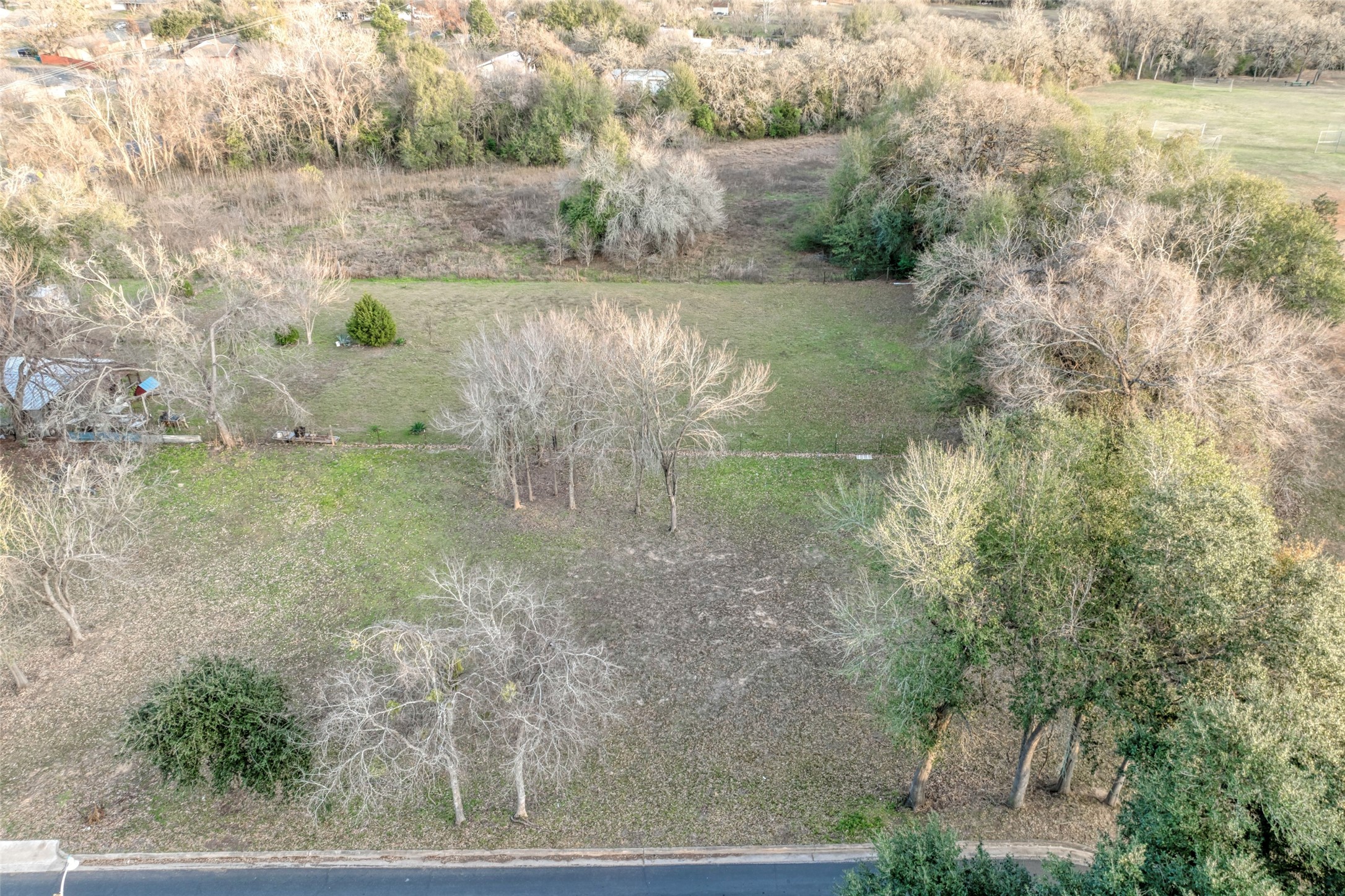 Lot 4 East Alamo Street Elgin, TX 78621 - Photo 7 of 14 a view of a lake with outdoor space
