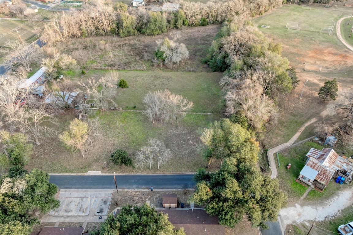 Lot 4 East Alamo Street Elgin, TX 78621 - Photo 8 of 14 an aerial view of a house with a yard