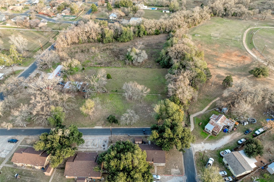 Lot 4 East Alamo Street Elgin, TX 78621 - Photo 9 of 14 an aerial view of a house with a yard