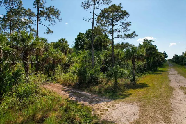 a view of a lake with a house in background