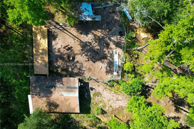 an aerial view of residential house with outdoor space