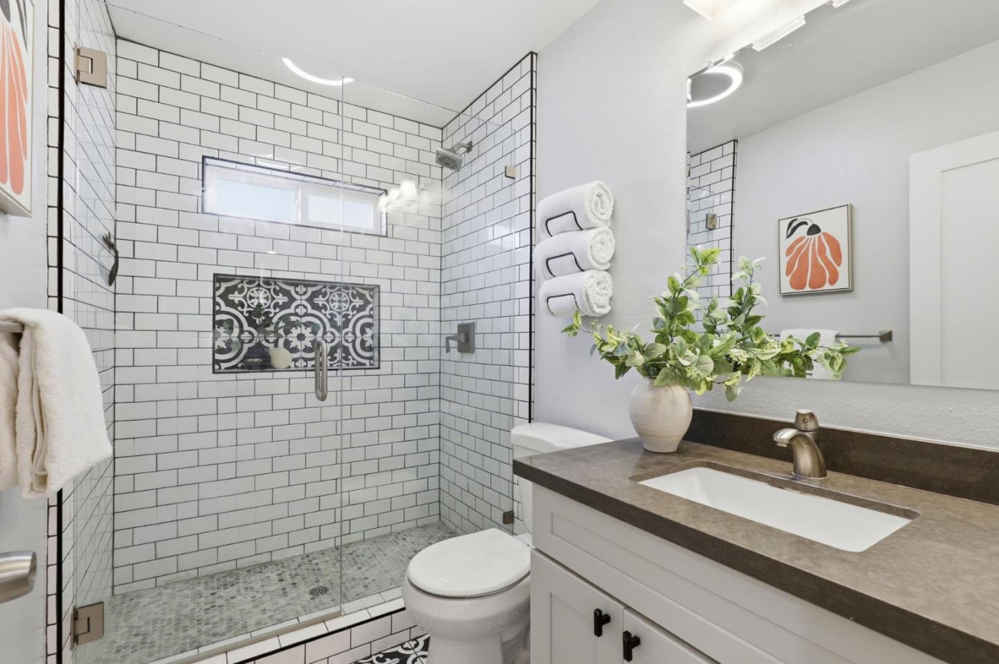 140 Second Street Gilroy, CA 95020 - Photo 27 of 33 a bathroom with a granite countertop toilet sink and mirror
