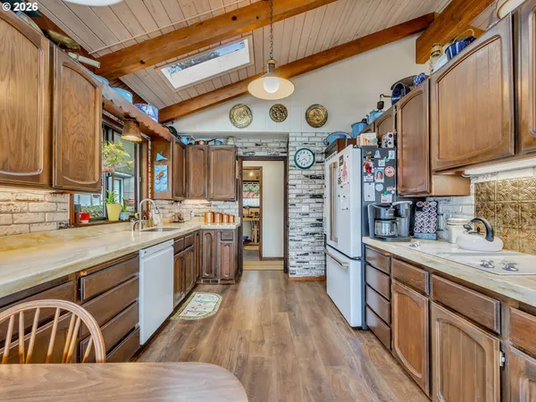 a kitchen with refrigerator and cabinets