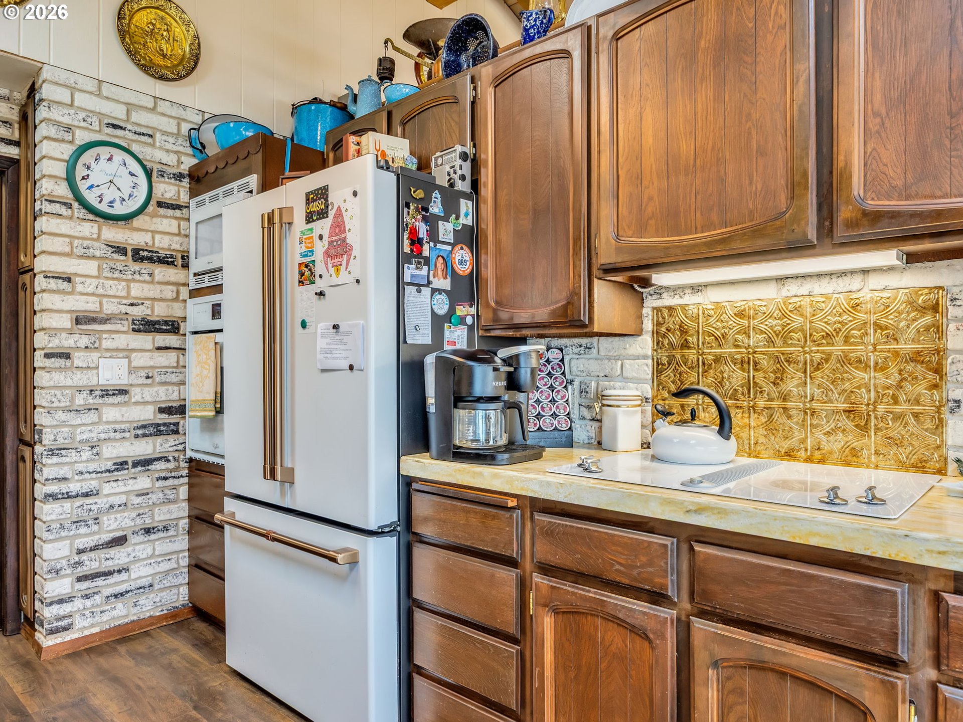 61 Gamble Street Wheeler, OR 97147 - Photo 13 of 45 a kitchen with refrigerator and cabinets