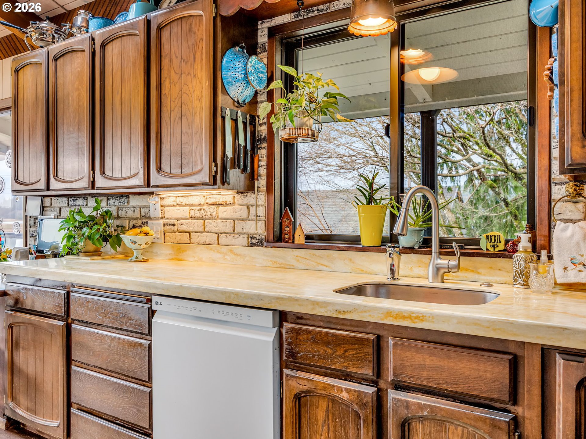 61 Gamble Street Wheeler, OR 97147 - Photo 14 of 45 a kitchen with a sink and a window