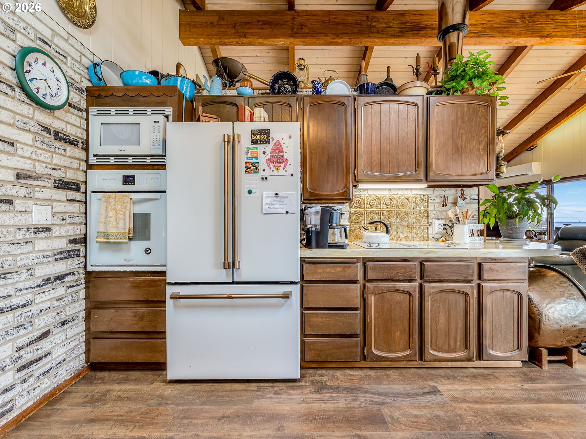 61 Gamble Street Wheeler, OR 97147 - Photo 15 of 45 a kitchen with stainless steel appliances granite countertop a refrigerator and a stove