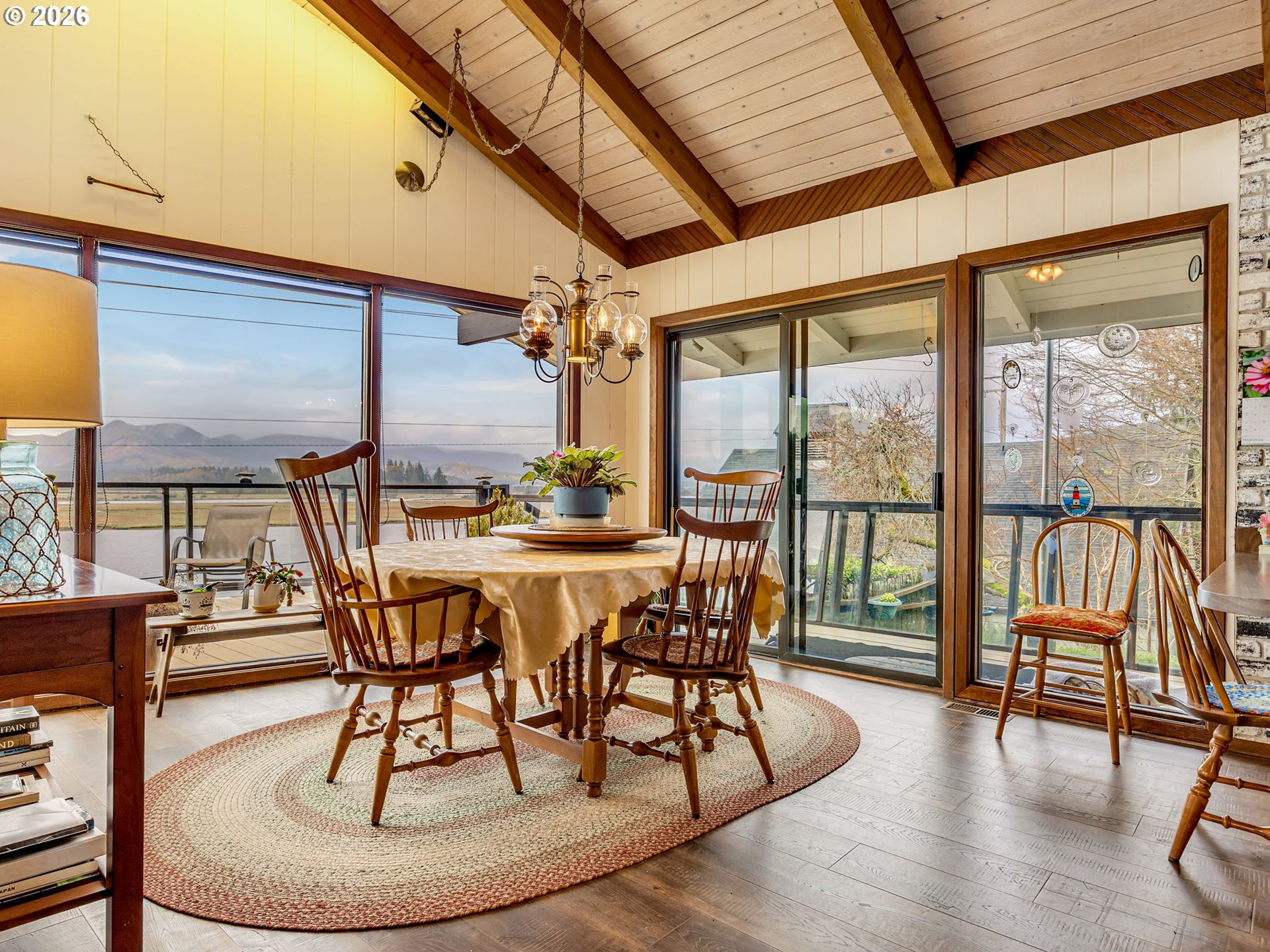 61 Gamble Street Wheeler, OR 97147 - Photo 18 of 45 a dining room with furniture window and wooden floor