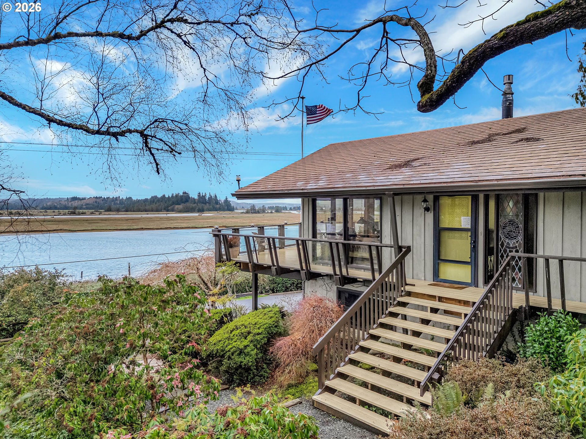 61 Gamble Street Wheeler, OR 97147 - Photo 2 of 45 a front view of a house with a yard balcony