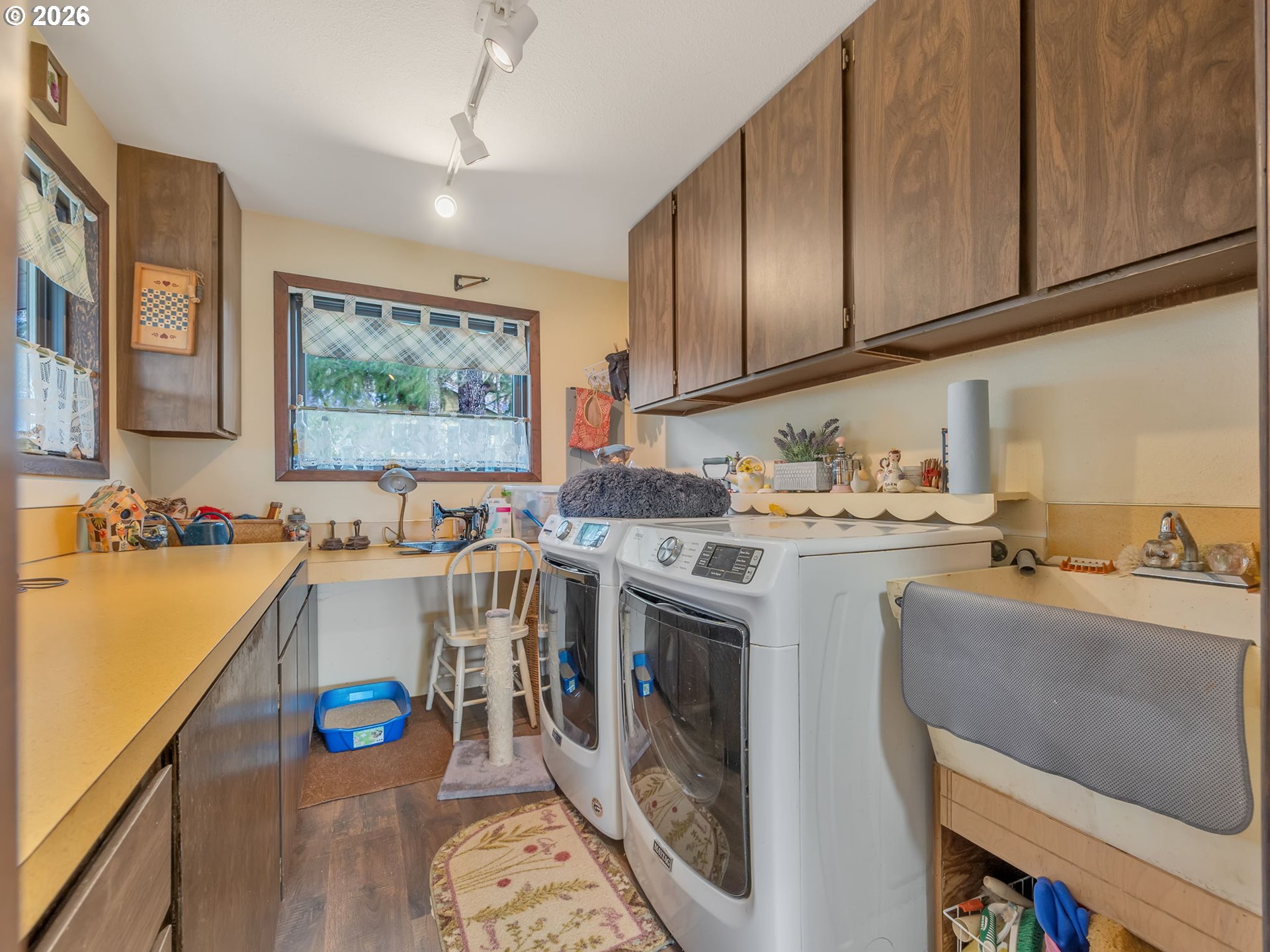 61 Gamble Street Wheeler, OR 97147 - Photo 27 of 45 a view of a kitchen with kitchen island a sink a stove and wooden floors