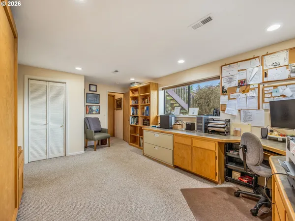 a room with furniture a flat screen tv and a floor to ceiling window