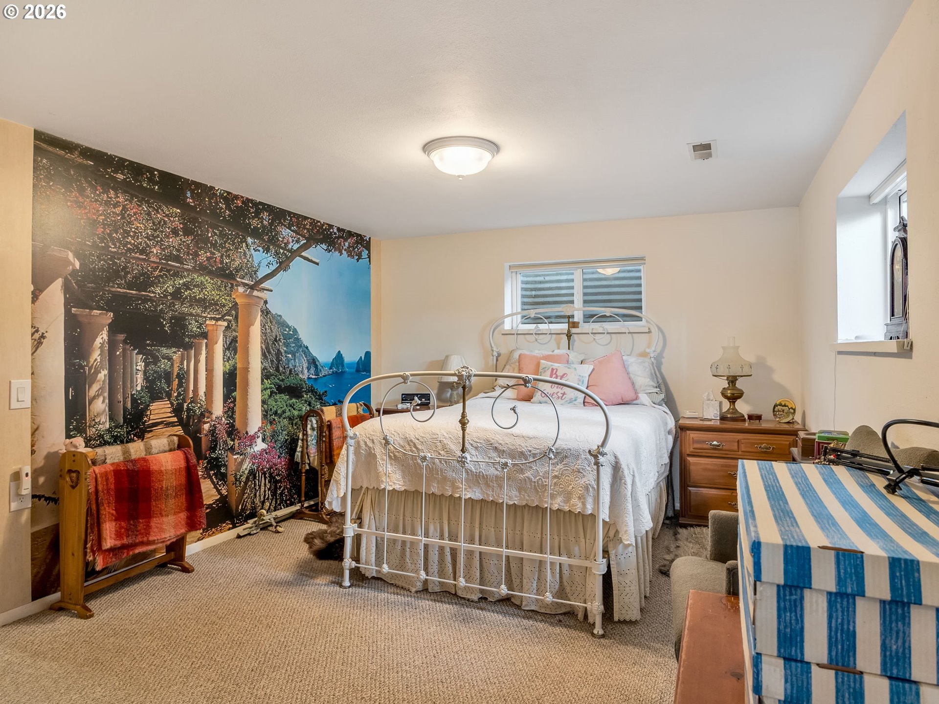 61 Gamble Street Wheeler, OR 97147 - Photo 31 of 45 a bedroom with bed and a large window