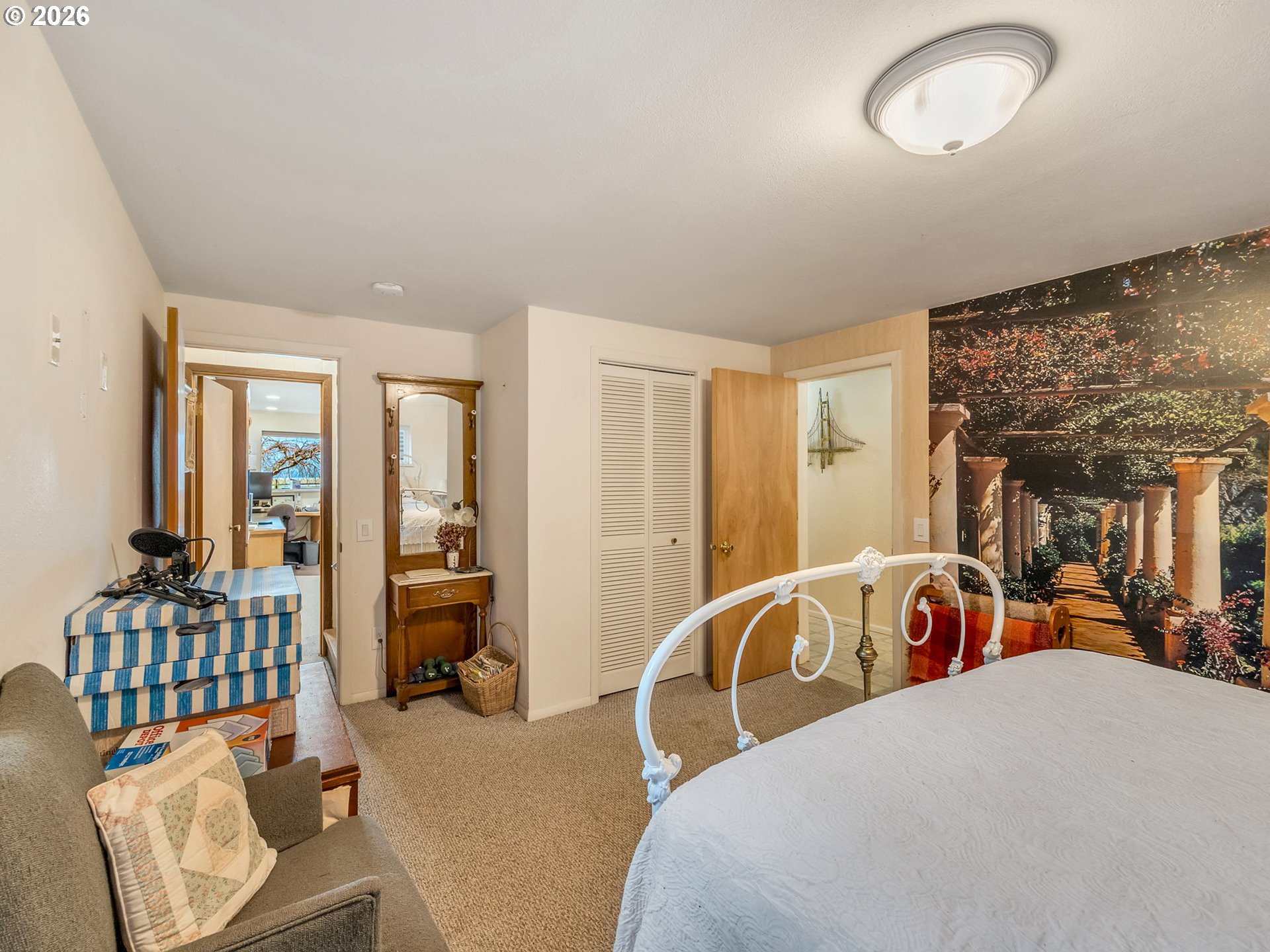 61 Gamble Street Wheeler, OR 97147 - Photo 32 of 45 a bedroom with a bed and glass door