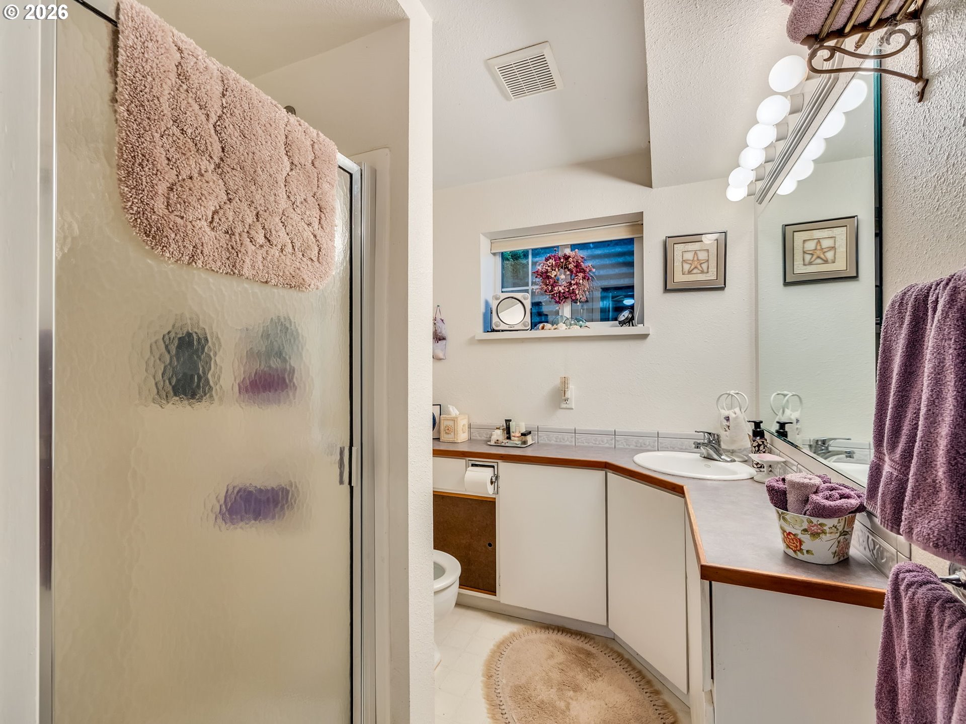 61 Gamble Street Wheeler, OR 97147 - Photo 33 of 45 a view of a bathroom with a sink and mirror