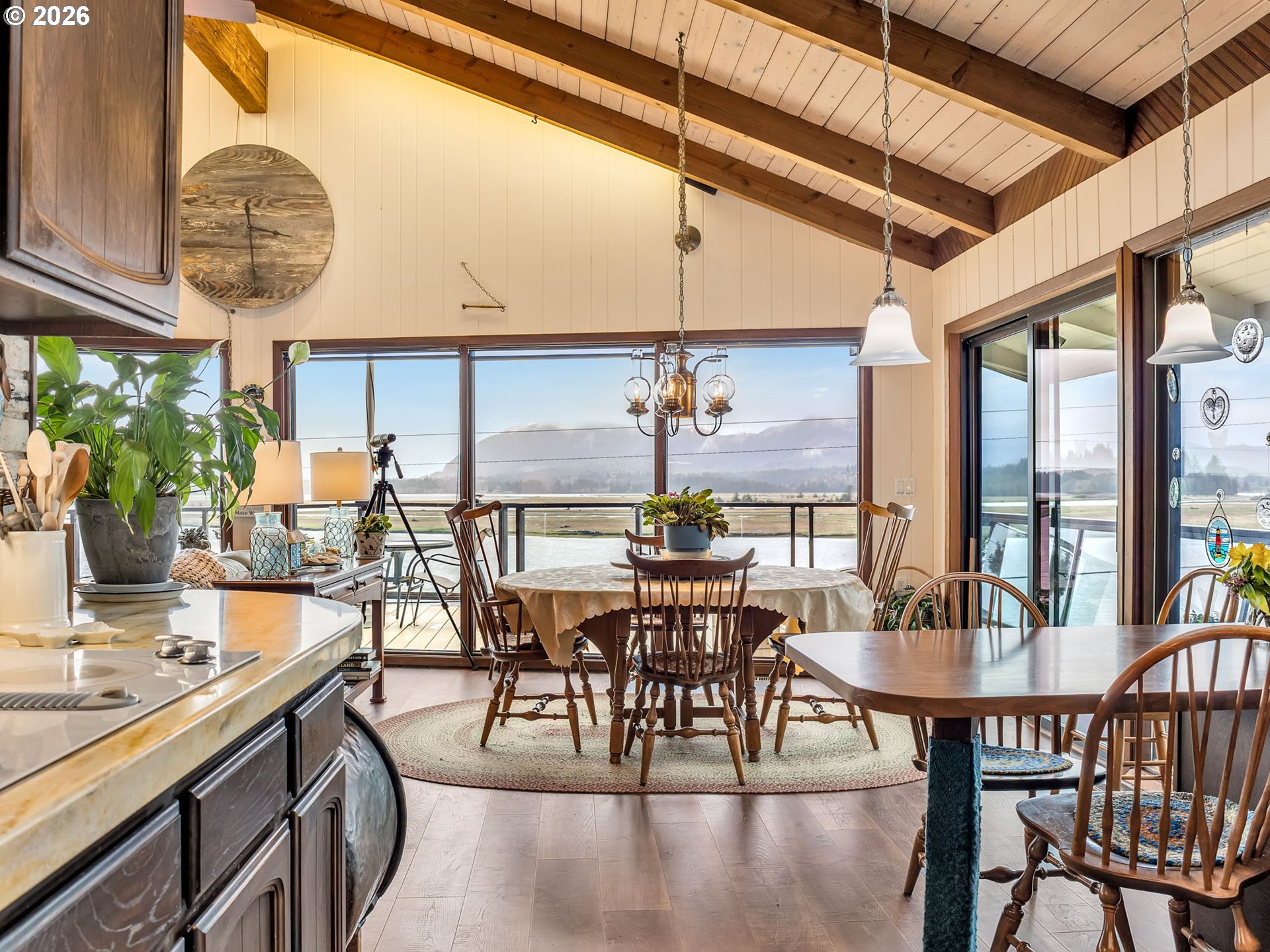 61 Gamble Street Wheeler, OR 97147 - Photo 10 of 45 a view of a dining room with furniture window and wooden floor