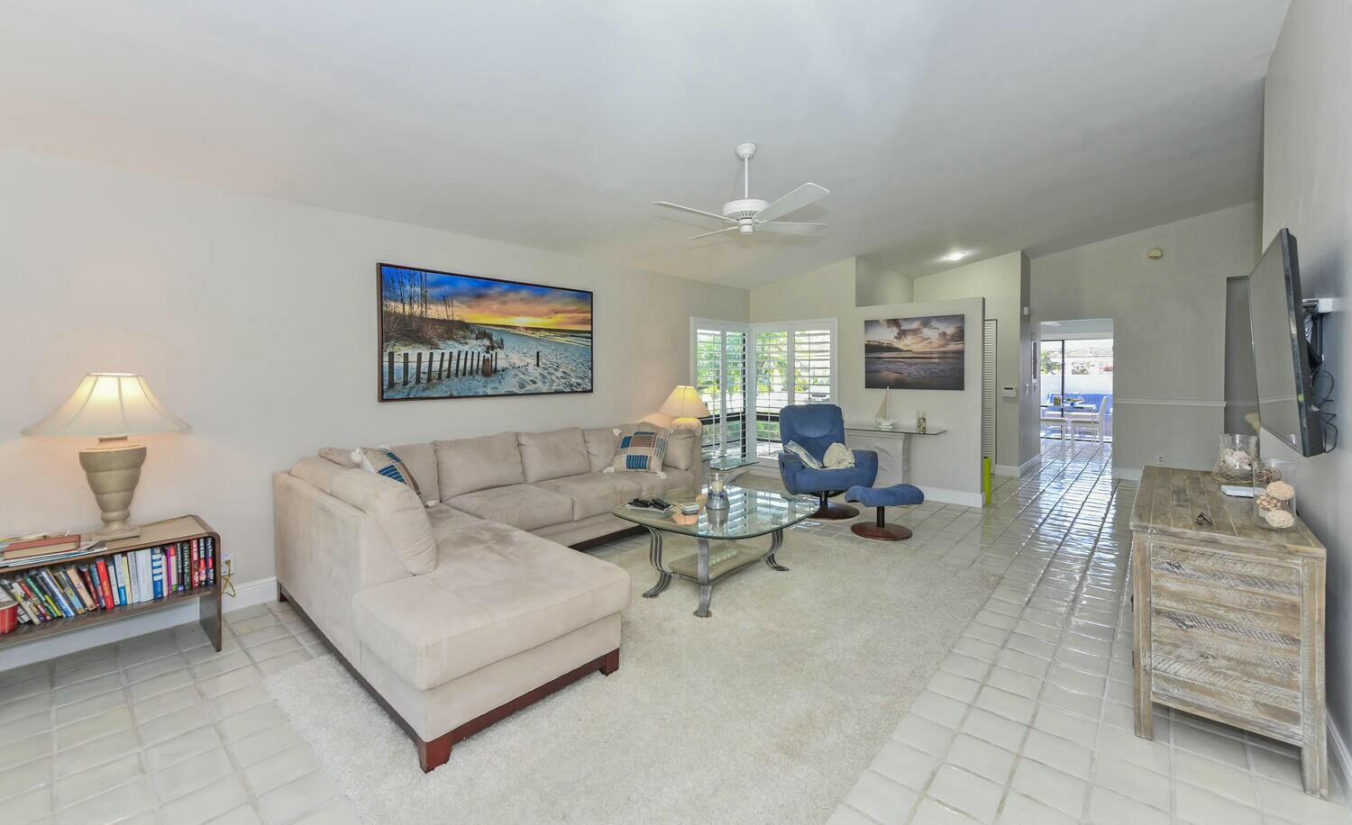 3736 Freshwater Drive Jupiter, FL 33477 - Photo 12 of 28 a living room with furniture and a flat screen tv