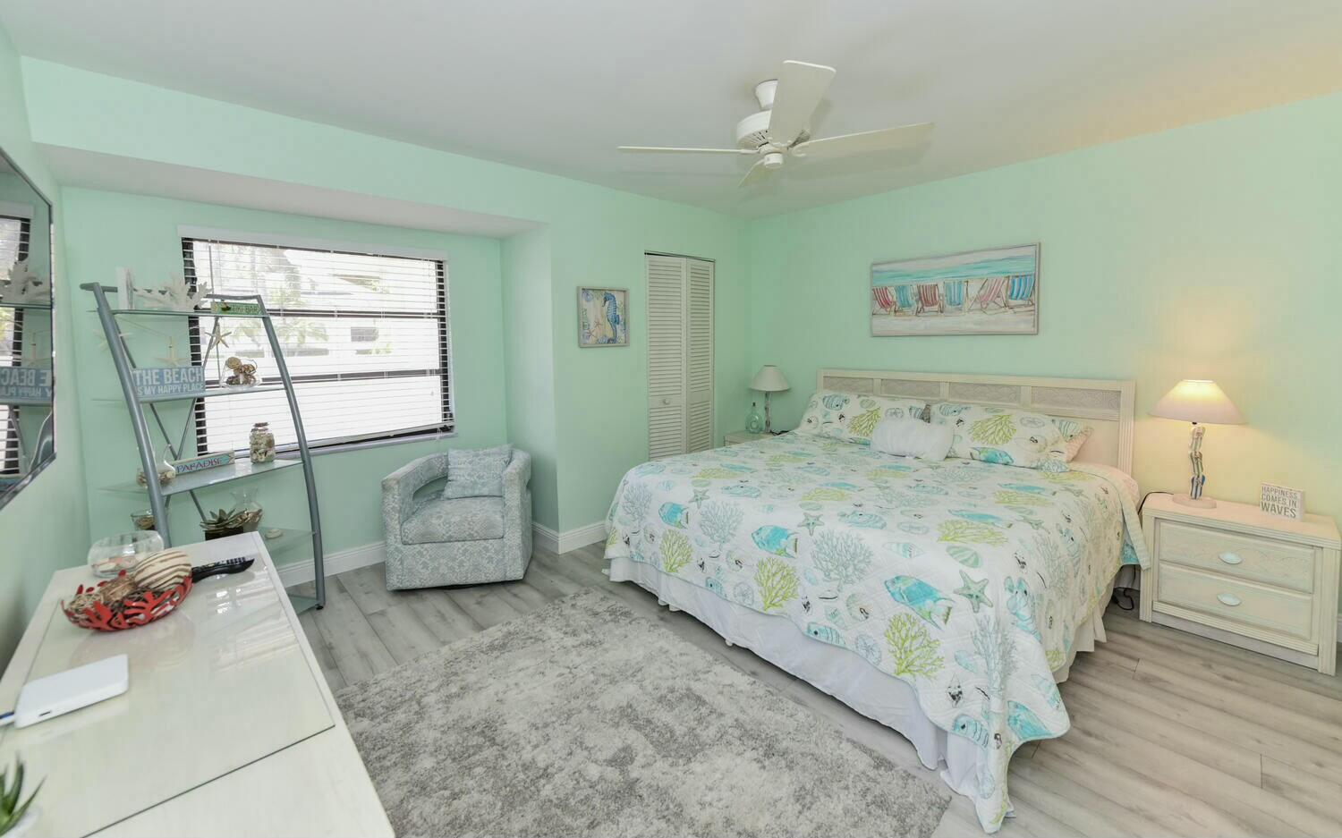 3736 Freshwater Drive Jupiter, FL 33477 - Photo 18 of 28 a bedroom with a bed and a couch