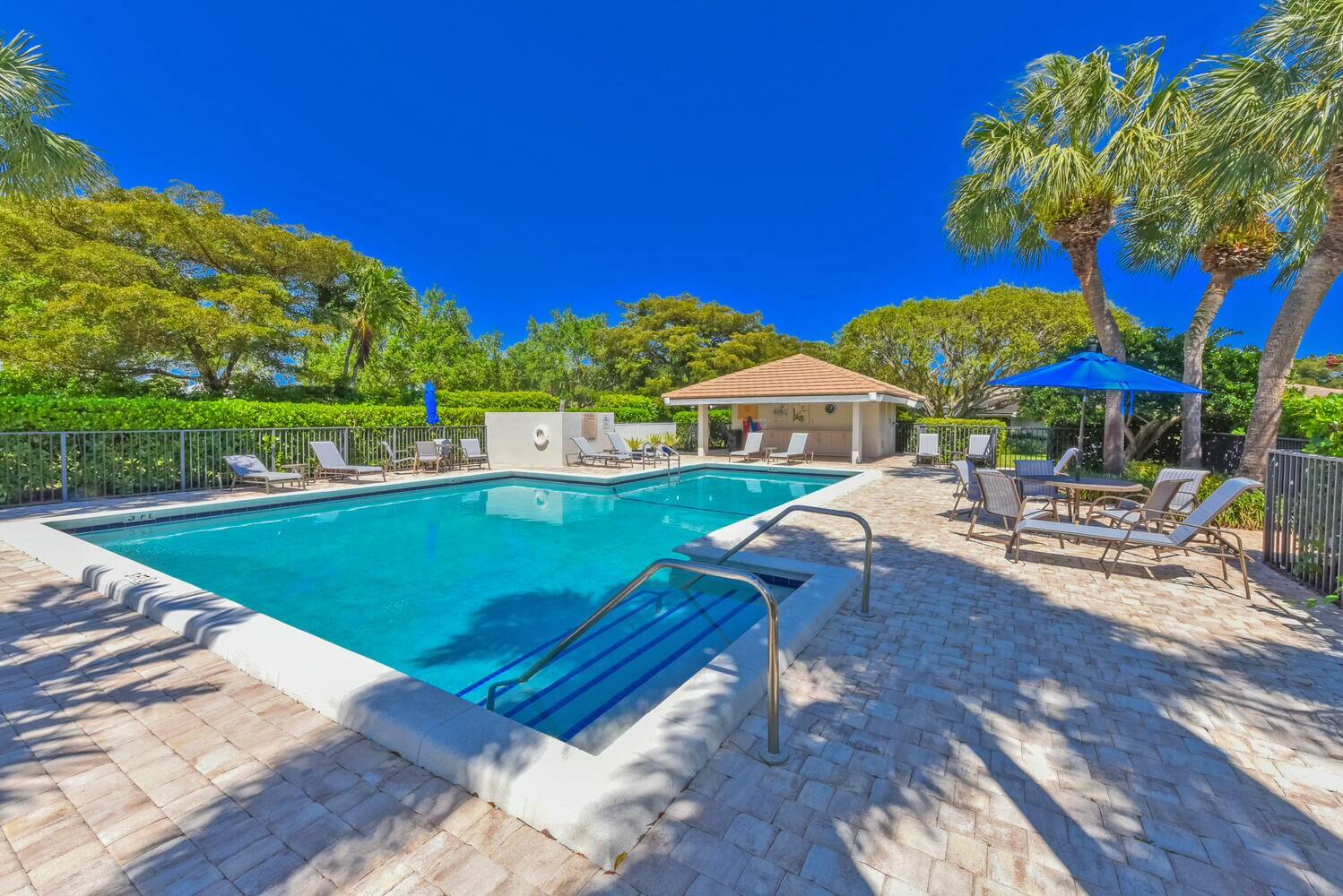3736 Freshwater Drive Jupiter, FL 33477 - Photo 23 of 28 a view of a chairs and table on the deck