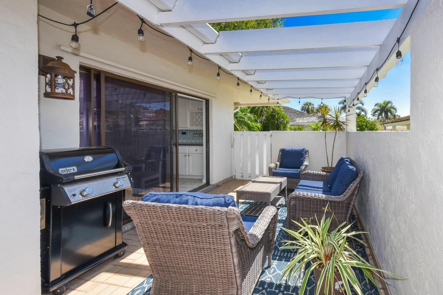 3736 Freshwater Drive Jupiter, FL 33477 - Photo 3 of 28 a dining room with furniture and a fireplace