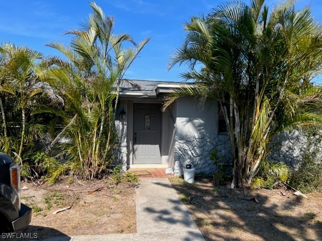a view of a house with a tree