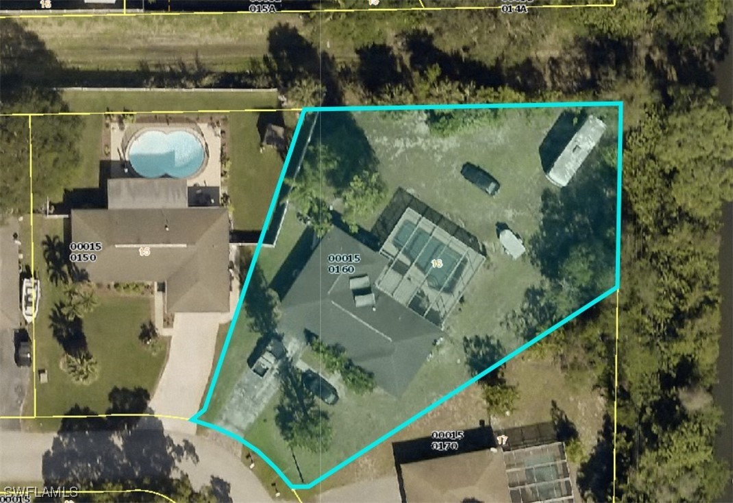 1691 North Hermitage Road Fort Myers, FL 33919 - Photo 15 of 15 an aerial view of a house with a lake view