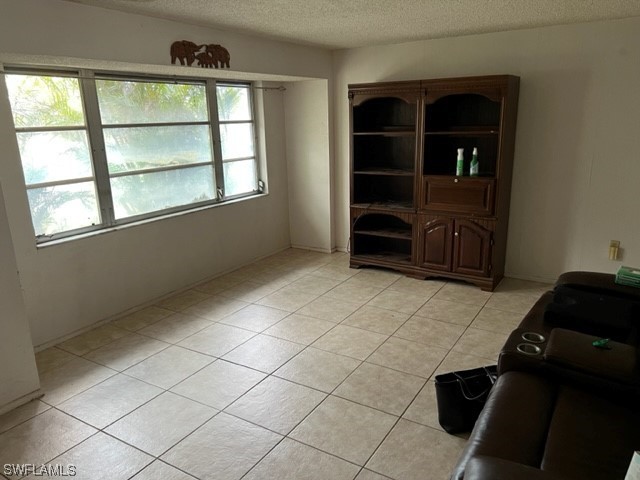 1691 North Hermitage Road Fort Myers, FL 33919 - Photo 2 of 15 an empty room with windows
