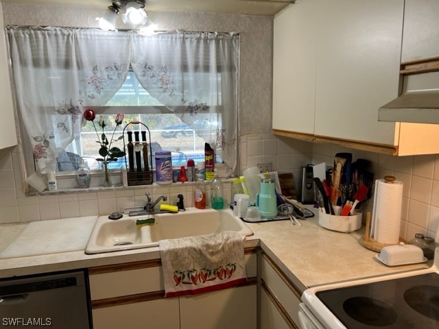 1691 North Hermitage Road Fort Myers, FL 33919 - Photo 7 of 15 a kitchen with a sink and a stove
