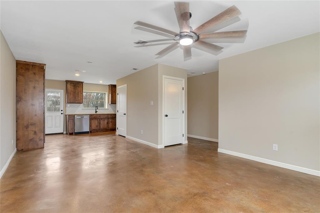 1371 Cr-704a, Unit 2 Joshua, TX 76058 - Photo 1 of 20 Unfurnished living room with ceiling fan, sink, and concrete floors