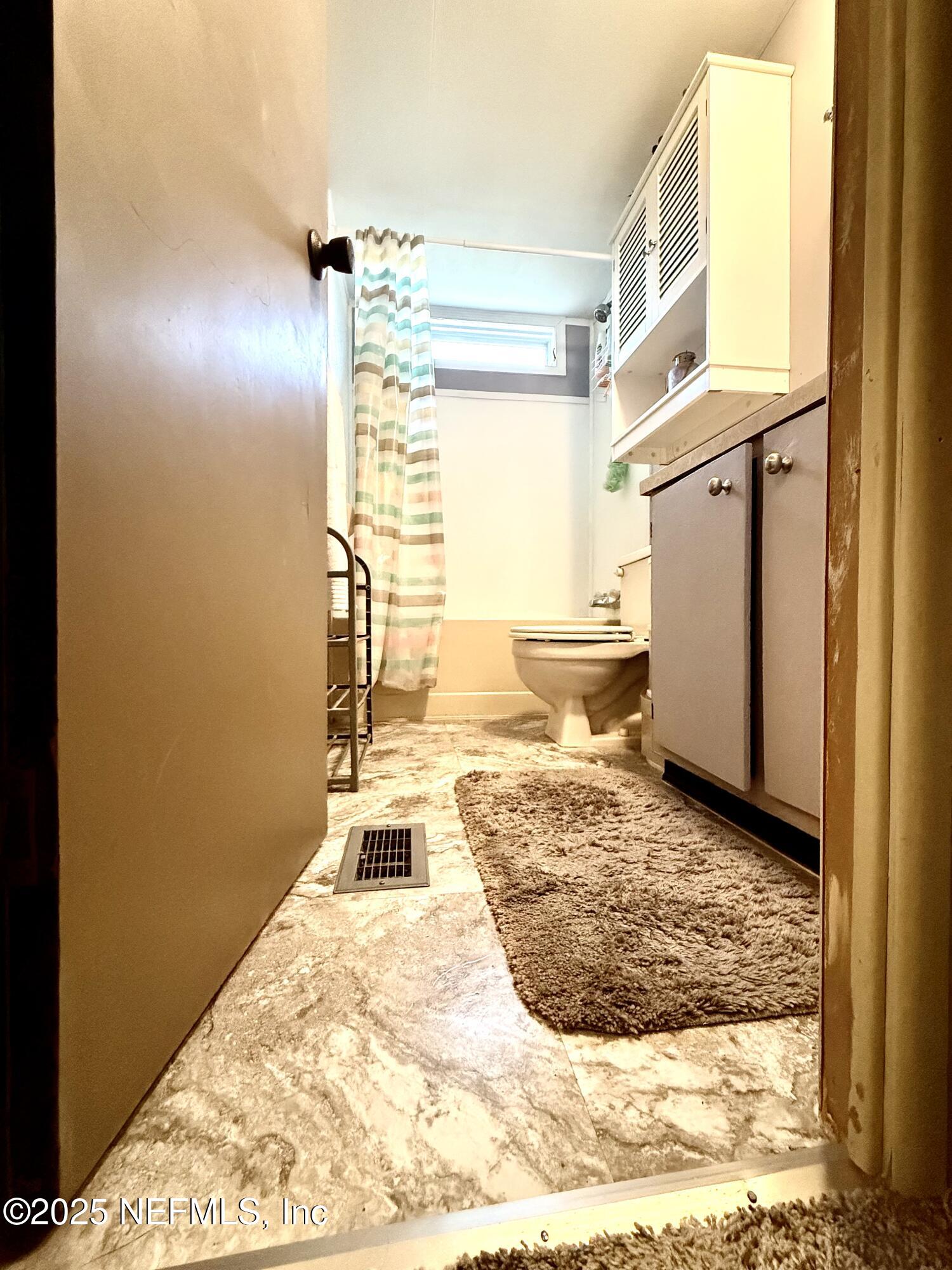 210 Lenore Avenue Interlachen, FL 32148 - Photo 33 of 43 a very nice looking room with a large window