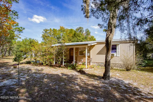 a terrace of a building with table and chairs