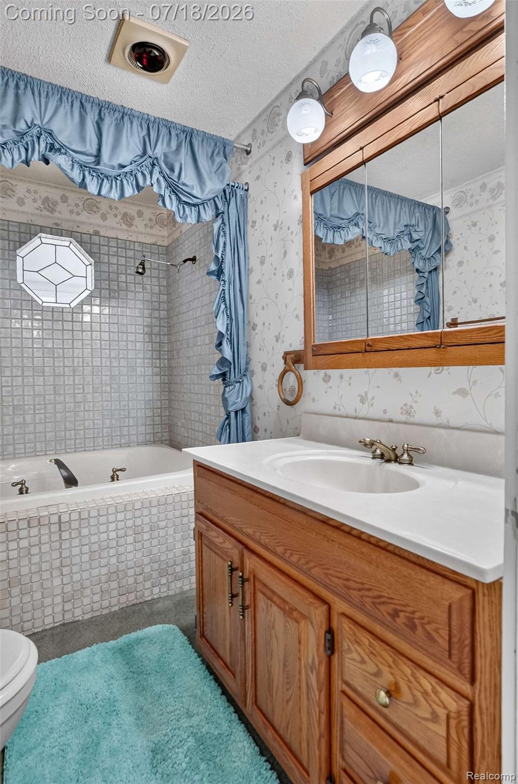 1437 East Cook Road Grand Blanc, MI 48439 - Photo 42 of 69 Bathroom with a built-in tub featuring square tile surround and a decorative octagonal window
