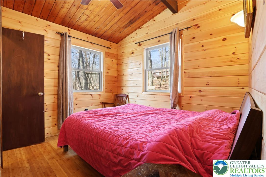 214 Mockingbird Court Bushkill, PA 18324 - Photo 14 of 40 a bedroom with a bed and a window