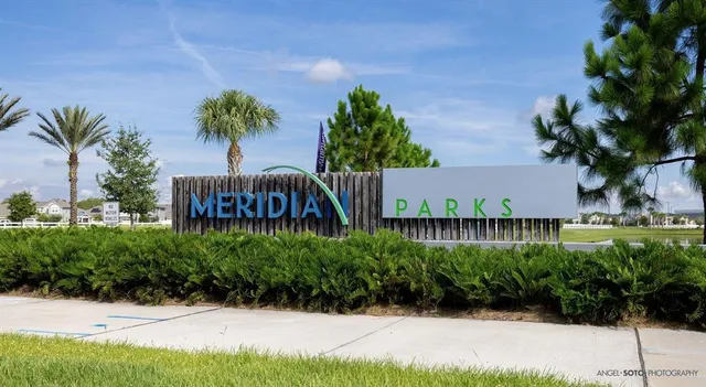 a view of a garden with a building in the background